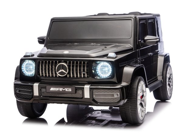 Mașină electrică de jucărie Mercedes-Benz G63 AMG 4x4 cu două locuri, negru, player MP3 cu conexiune USB/AUX și Bluetooth, tracțiune 4x4, baterie litiu, roți EVA cu suspensie, scaune din piele artificială, telecomandă, licență originală